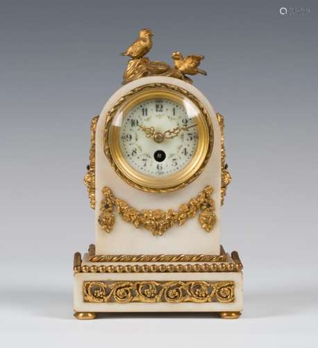 A late 19th/early 20th century French ormolu and white marble mantel timepiece, the drum cased