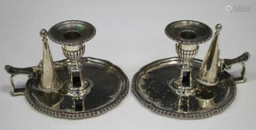 A pair of early Victorian silver chambersticks, each with a detachable gadrooned nozzle above a