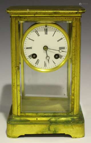 A late 19th/early 20th century gilt brass four glass mantel clock with eight day movement striking