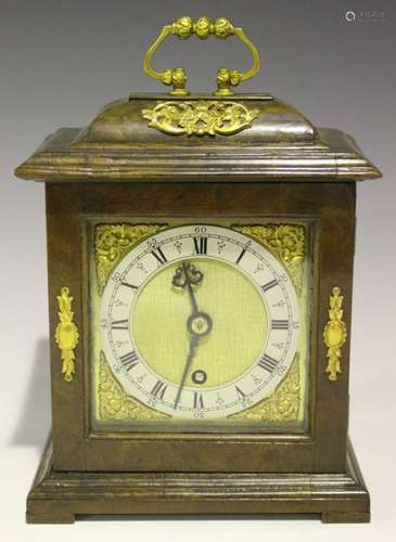 A 20th century walnut cased mantel timepiece, the brass movement with platform escapement, the