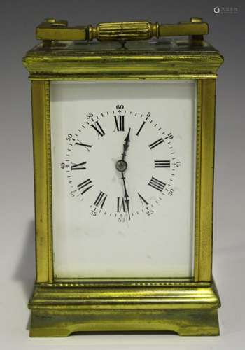 A late 19th century/early 20th century French lacquered brass carriage clock with eight day movement