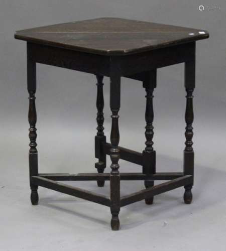 A George V oak gateleg corner occasional table, on turned and block legs, height 74cm, width 79cm.