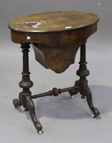 A late Victorian walnut and boxwood inlaid oval work table, the hinged lid revealing a fitted