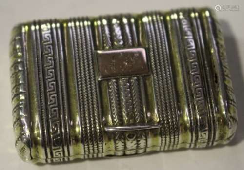 A George III silver and parcel gilt rectangular vinaigrette in the form of a purse with banded