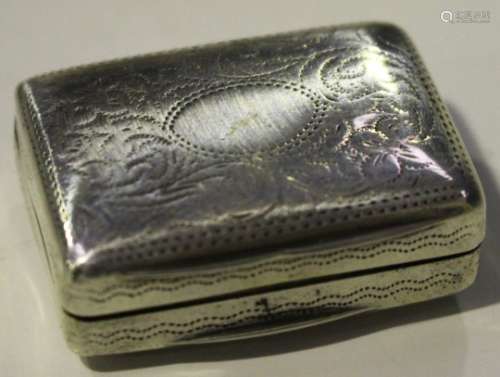 An early Victorian silver rectangular vinaigrette with engraved foliate scroll decoration, the