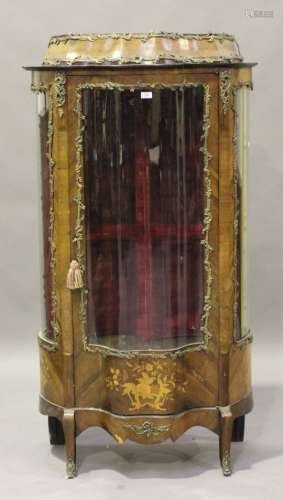 A late 19th century French kingwood and marquetry inlaid serpentine fronted vitrine with gilt