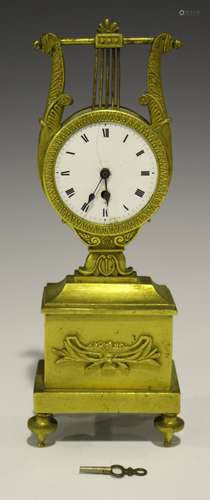 An early 19th century French ormolu watch stand, the unsigned pocket watch movement with pierced and