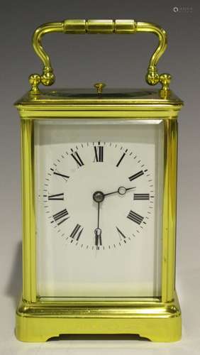 An early 20th century French lacquered brass cased carriage clock by Margaine of Paris, the eight