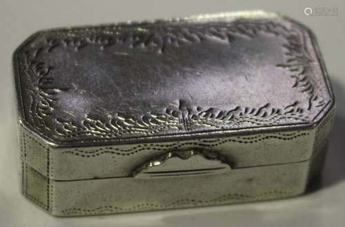 An early 19th century Continental white metal canted corner rectangular vinaigrette with engraved