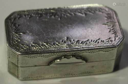 An early 19th century Continental white metal canted corner rectangular vinaigrette with engraved