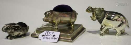 An Edwardian silver novelty pin cushion in the form of a pig on a rectangular base, Birmingham