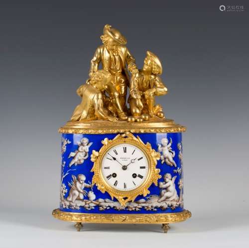 A late 19th century French ormolu and porcelain mantel clock with eight day movement striking on a