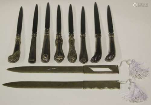 A pair of Elizabeth II silver paper knives, one with wavy edged handle, the other pierced, import