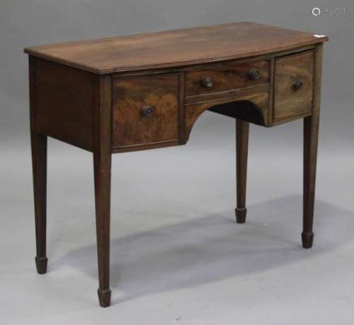 A 19th century mahogany bowfront sideboard, fitted with three drawers, on square tapering legs and