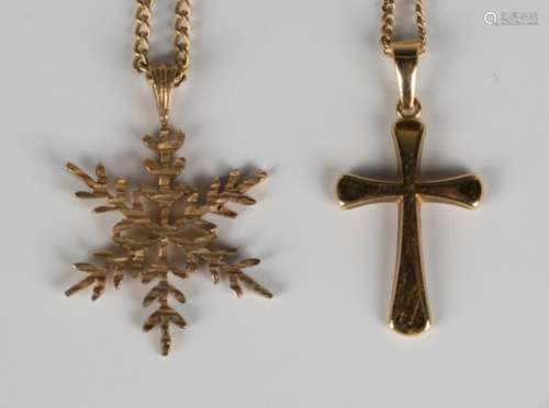 A 9ct gold pendant, designed as a snowflake, length 2.7cm, with a 9ct gold curblink neckchain,