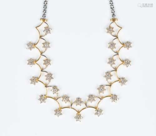 A two colour gold and diamond necklace, the front formed as two rows of diamond set seven stone