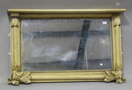 A 19th century stripped softwood overmantel mirror with carved decoration and turned pilasters, 73cm