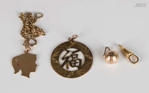 A 9ct gold pendant, designed as the head of a girl, length 2.5cm, fitted to a gold bracelet,