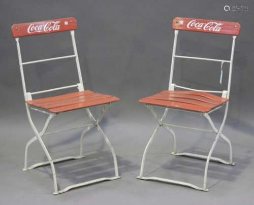A pair of mid-20th century Coca-Cola advertising folding café chairs, the backs detailed 'Ingobrau
