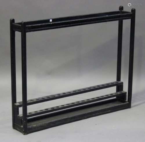 An early 20th century black painted walking stick display stand, height 86cm, width 109cm.Buyer’s