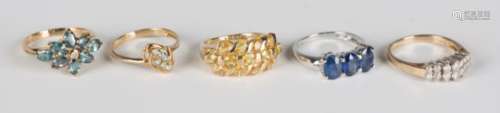 A 9ct gold ring, claw set with two rows of seven circular cut diamonds, a 9ct white gold ring,