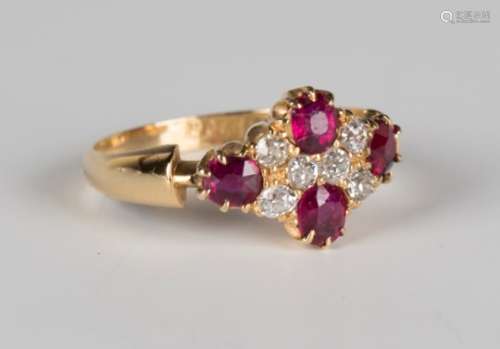 An Edwardian 18ct gold, ruby and diamond ring in a lozenge shaped design, claw set with four