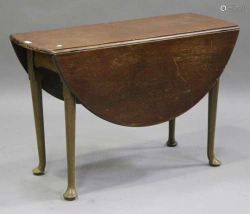 A 19th century mahogany oval drop-flap dining table, on turned legs and pad feet, height 71cm, width
