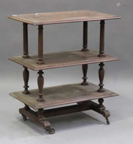 An early 20th century French walnut three-tier buffet, on turned and fluted supports, height 96cm,