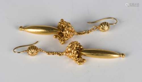 A pair of gold pendant earrings with faceted decoration and pendant bead drops, with hook shaped