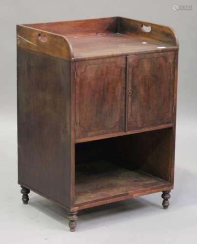 An early 19th century mahogany wash stand with ebony stringing, the gallery top with pierced