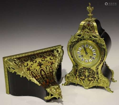 A late 19th/early 20th century French gilt brass mounted red tortoiseshell boulle cased bracket