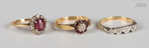 An 18ct gold, ruby and diamond nine stone cluster ring, a gold, platinum and diamond five stone