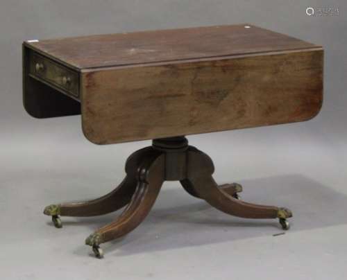 An early Victorian mahogany single pedestal Pembroke table, fitted with a frieze drawer, raised on