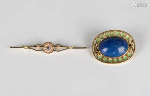 A gold, lapis lazuli and green enamelled oval brooch, mounted with a lapis lazuli within a green