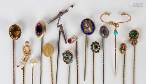 A collection of fourteen stickpins, including an enamelled fourpence and an articulated doll.Buyer’s