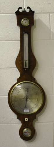 A George III figured mahogany wheel barometer with silvered dials, hygrometer, alcohol thermometer