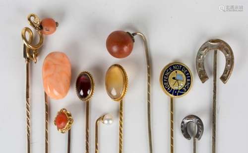 A carbuncle garnet single stone stickpin, a gold and coral stickpin, a gold and cultured pearl