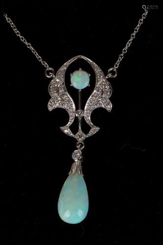 An 18ct white gold, opal and diamond pendant necklace in an open scrolling design, the front mounted