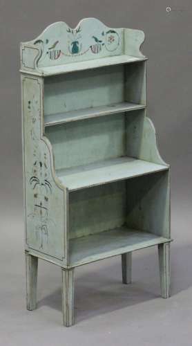 An early 20th century Swedish painted open bookcase, the shaped gallery decorated with birds and