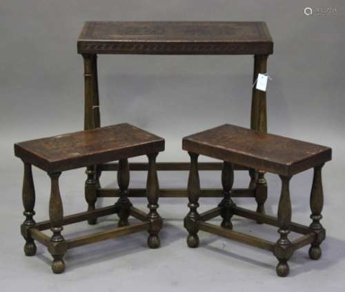 A set of three mid-20th century oak occasional tables, comprising one large and two small, with