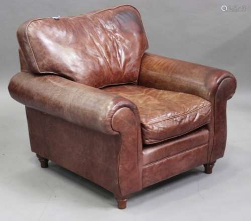 A modern Laura Ashley brown leather club armchair, on turned feet, height 90cm, width 100cm.Buyer’