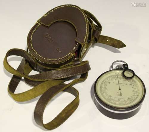 A mid-20th century black enamelled brass cased surveying aneroid pocket barometer, the silvered