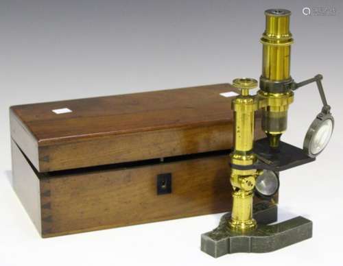 A late 19th century French lacquered brass monocular microscope, the body tube signed 'E. Hartnack &