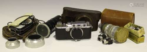 A Leica III camera, No. 235197, circa 1937, with Elmar f=5cm 1:3.5 lens, leather cased, together