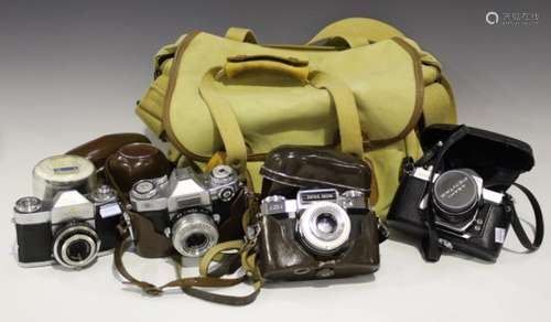 A small group of four cameras, comprising a Zeiss Ikon Contaflex, two Zeiss Ikon Super Contaflex and