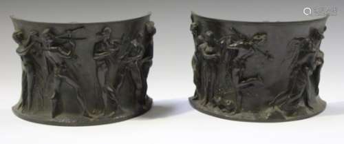 A pair of late 19th century brown patinated cast bronze pedestal mounts, decorated with bands of