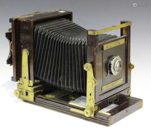 A Kodak 'Model B' folding view camera with black bellows and brass mounts, fitted with a Ross of