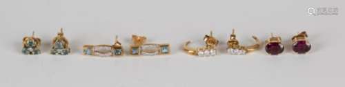 A pair of 9ct gold and diamond three stone earstuds, a pair of 9ct gold and rhodolite garnet