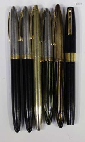 A group of six Sheaffer fountain pens, all with '14k' gold nibs, two with striped plastic cases.