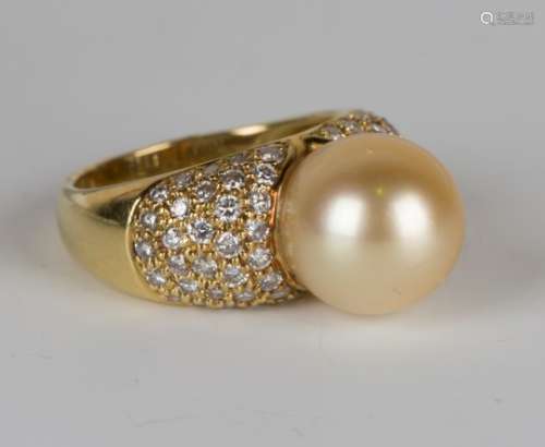 A gold, diamond and South Sea yellow tinted pearl ring, mounted with the yellow tinted pearl between